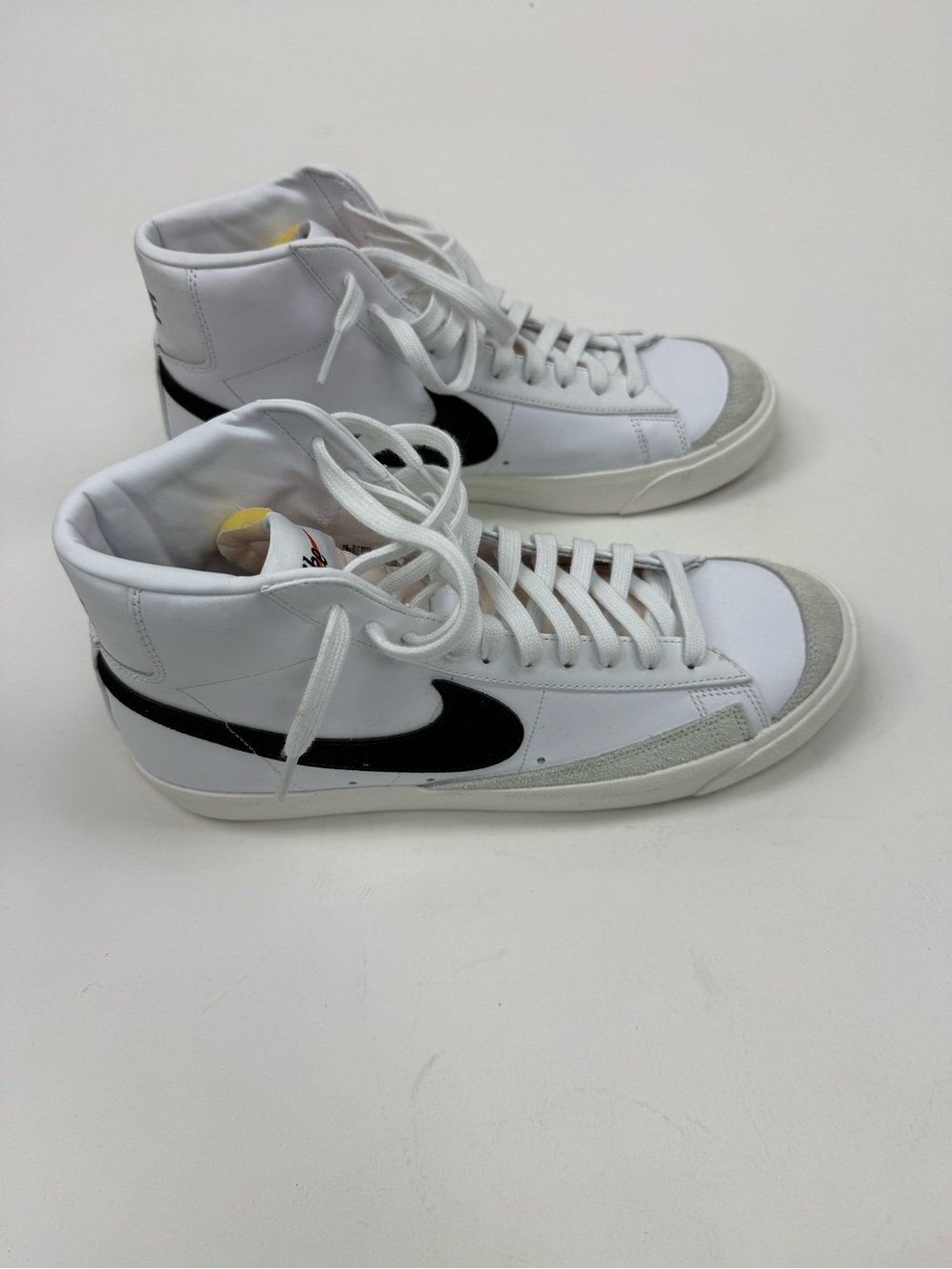 Nike White High-Top Sneakers with Black Swoosh